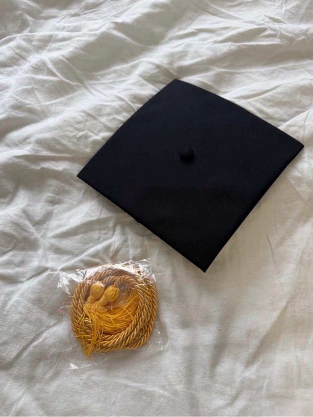 Black Graduation Cap with Gold Chord